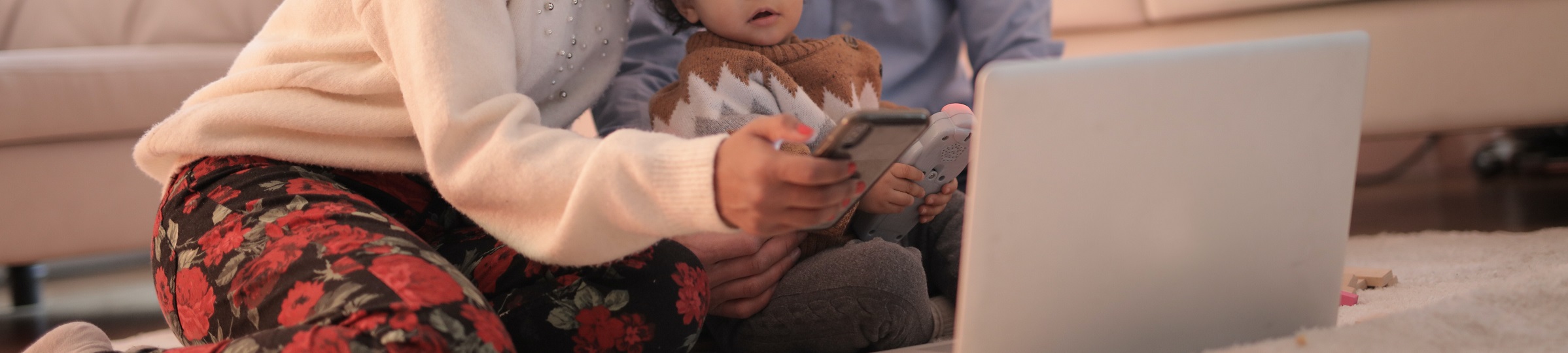 photo-of-woman-using-smartphone-while-sitting-near-her-baby-3820159